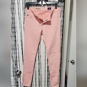 Women's AG peach colored jeans. Zipper ankle. Size 25R